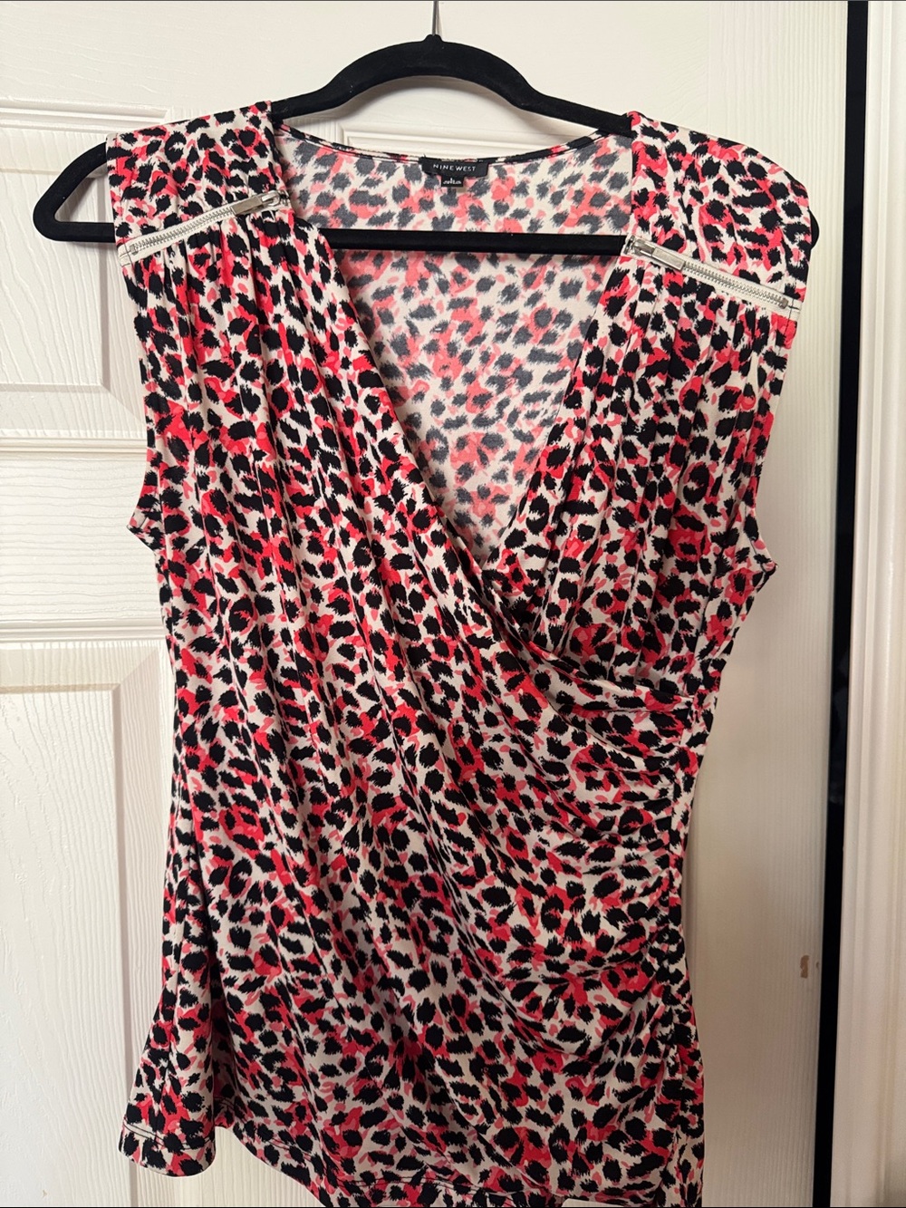 Nine West coral/Pink and Black Leopard Print Surplice dress top.